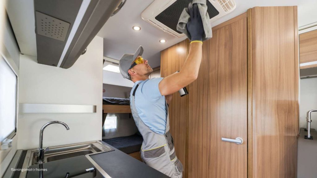 Man fixing roof leakage of Motorhome.